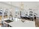 Modern kitchen with a central island connects to a living area, offering an open design at 1967 Nash Se Ave, Atlanta, GA 30316