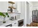 Kitchenette with stainless appliances, open shelving, and drink fridge at 1967 Nash Se Ave, Atlanta, GA 30316