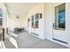 Covered front porch features recessed lighting and outdoor seating with black metal railing at 1967 Nash Se Ave, Atlanta, GA 30316