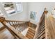 Staircase with hardwood steps, iron railings, and natural light through the window at 1967 Nash Se Ave, Atlanta, GA 30316