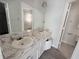 Bathroom featuring a double sink vanity and a large mirror at 2575 Picardy N Cir # B, Atlanta, GA 30349