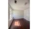 Bright bedroom with hardwood floors and window at 2575 Picardy N Cir # B, Atlanta, GA 30349