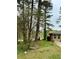 Exterior view of back yard featuring mature trees and well maintained yard at 6079 Zachary Ct, Norcross, GA 30093
