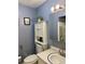 Classic bathroom featuring modern sink, toilet, and decorative accents at 6079 Zachary Ct, Norcross, GA 30093