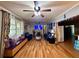 Spacious living room with bright natural light, hardwood floors, and comfortable seating at 6079 Zachary Ct, Norcross, GA 30093