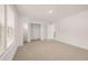 Bedroom with neutral carpet, natural light, and an open closet at 13912 Homer, Covington, GA 30014