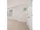 Bright bedroom with neutral carpet, white trim, and a view of the neighborhood at 13912 Homer, Covington, GA 30014
