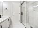 Bathroom featuring a tiled shower, a black-trimmed glass door, black fixtures, and a white vanity at 1784 Hollingsworth Nw Blvd, Atlanta, GA 30318