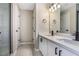 Bathroom featuring double sink vanity with modern black fixtures and a large mirror at 1784 Hollingsworth Nw Blvd, Atlanta, GA 30318