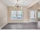 Living room with high ceilings and a modern light fixture at 1784 Hollingsworth Nw Blvd, Atlanta, GA 30318