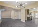 Open concept living space with modern lighting and gray wood flooring at 1784 Hollingsworth Nw Blvd, Atlanta, GA 30318