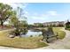 Picturesque pond in a park setting with benches and walking paths at 1784 Hollingsworth Nw Blvd, Atlanta, GA 30318