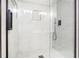 Modern shower with gray tile, glass door and matte black fixtures at 1784 Hollingsworth Nw Blvd, Atlanta, GA 30318