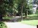 Long driveway leading to a charming home surrounded by mature trees at 1908 Bouldercrest Se Rd, Atlanta, GA 30316