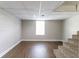 Unfinished basement featuring a window for natural light and carpeted stairs at 2619 Del Ridge Dr, Douglasville, GA 30135