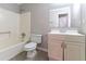 Bathroom featuring a shower-tub combo, a modern vanity with mirror, and neutral tile flooring at 2619 Del Ridge Dr, Douglasville, GA 30135
