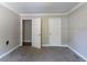 Bedroom featuring carpet floors, offering space for relaxation with easy bathroom access at 2619 Del Ridge Dr, Douglasville, GA 30135
