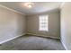 Comfortable bedroom with carpet floors and a bright window, offering a relaxing retreat at 2619 Del Ridge Dr, Douglasville, GA 30135