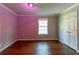 Bedroom featuring hardwood floors and a bright window, complete with a storage closet at 2619 Del Ridge Dr, Douglasville, GA 30135