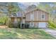 Charming home with a two-car garage featuring stone accents and inviting front porch at 2619 Del Ridge Dr, Douglasville, GA 30135