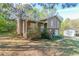 A charming home boasts a welcoming front porch and mature trees surrounding the property at 2619 Del Ridge Dr, Douglasville, GA 30135