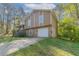 Charming home featuring a two-car garage with stone accents and a well-maintained lawn at 2619 Del Ridge Dr, Douglasville, GA 30135