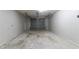 Empty garage with a gray door, awaiting your vehicle and storage needs at 2619 Del Ridge Dr, Douglasville, GA 30135