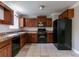 Functional kitchen with black appliances, ample cabinetry, and neutral tile flooring at 2619 Del Ridge Dr, Douglasville, GA 30135