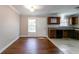 Bright kitchen adjacent to dining space, featuring laminate countertops and ample cabinetry at 2619 Del Ridge Dr, Douglasville, GA 30135