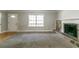Spacious living room featuring a stone fireplace, large window, and combination flooring at 2619 Del Ridge Dr, Douglasville, GA 30135