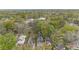 An aerial view shows the home nestled among lush greenery and a vibrant neighborhood at 323 Fayetteville Rd, Decatur, GA 30030