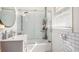 Bright bathroom features tiled shower with glass door, modern sink, and ample natural light at 323 Fayetteville Rd, Decatur, GA 30030