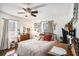 Cozy bedroom with a comfortable bed, wood floors, and warm lighting at 323 Fayetteville Rd, Decatur, GA 30030