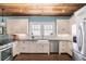 Bright kitchen with white cabinets, stainless steel appliances, and a modern farmhouse sink at 323 Fayetteville Rd, Decatur, GA 30030