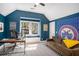 Bright living room featuring high vaulted ceiling, plush sofa, large window and designer rug at 323 Fayetteville Rd, Decatur, GA 30030