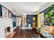 Charming living room with a fireplace, hardwood floors, and blue accent walls at 323 Fayetteville Rd, Decatur, GA 30030