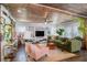 Spacious living room with exposed wooden ceiling, comfortable seating, and stylish decor at 323 Fayetteville Rd, Decatur, GA 30030