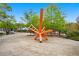 Modern orange sculpture in a park setting with walking paths, benches and spring trees at 323 Fayetteville Rd, Decatur, GA 30030