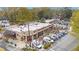 Aerial view of a charming brick storefront with ample parking and pedestrian access at 323 Fayetteville Rd, Decatur, GA 30030