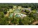 Overhead view of the community pool, tennis courts, clubhouse, and well-manicured golf course at 3669 High Green Dr, Marietta, GA 30068
