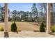 A view from a covered back porch shows a lush lawn and golf course in the distance at 3669 High Green Dr, Marietta, GA 30068