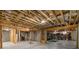 Unfinished basement with exposed wooden beams and concrete floor, ready for customization and expansion at 3669 High Green Dr, Marietta, GA 30068
