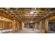 Spacious unfinished basement with exposed wooden beams and concrete floor, offering ample room for customization at 3669 High Green Dr, Marietta, GA 30068