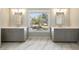 Bathroom featuring marble floors, dual vanities and a window with a view to the backyard at 3669 High Green Dr, Marietta, GA 30068