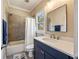Bathroom featuring custom vanity with quartz counters, tiled shower/tub combination and grey color palette at 3669 High Green Dr, Marietta, GA 30068