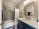 Bathroom featuring custom vanity with quartz counters, tiled shower/tub combination and grey color palette at 3669 High Green Dr, Marietta, GA 30068
