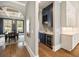 Butler's pantry leading to dining area with custom cabinets, wine fridge and ample counter space at 3669 High Green Dr, Marietta, GA 30068
