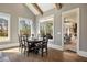 Bright dining room with hardwood floors, large windows, and an open view to the outdoor living space at 3669 High Green Dr, Marietta, GA 30068