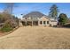 Beautiful brick home with a spacious backyard, covered porch, and well-maintained landscaping, ideal for families at 3669 High Green Dr, Marietta, GA 30068