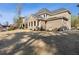 Brick two-story home with manicured lawn, lush landscaping, and expansive backyard, perfect for outdoor living at 3669 High Green Dr, Marietta, GA 30068